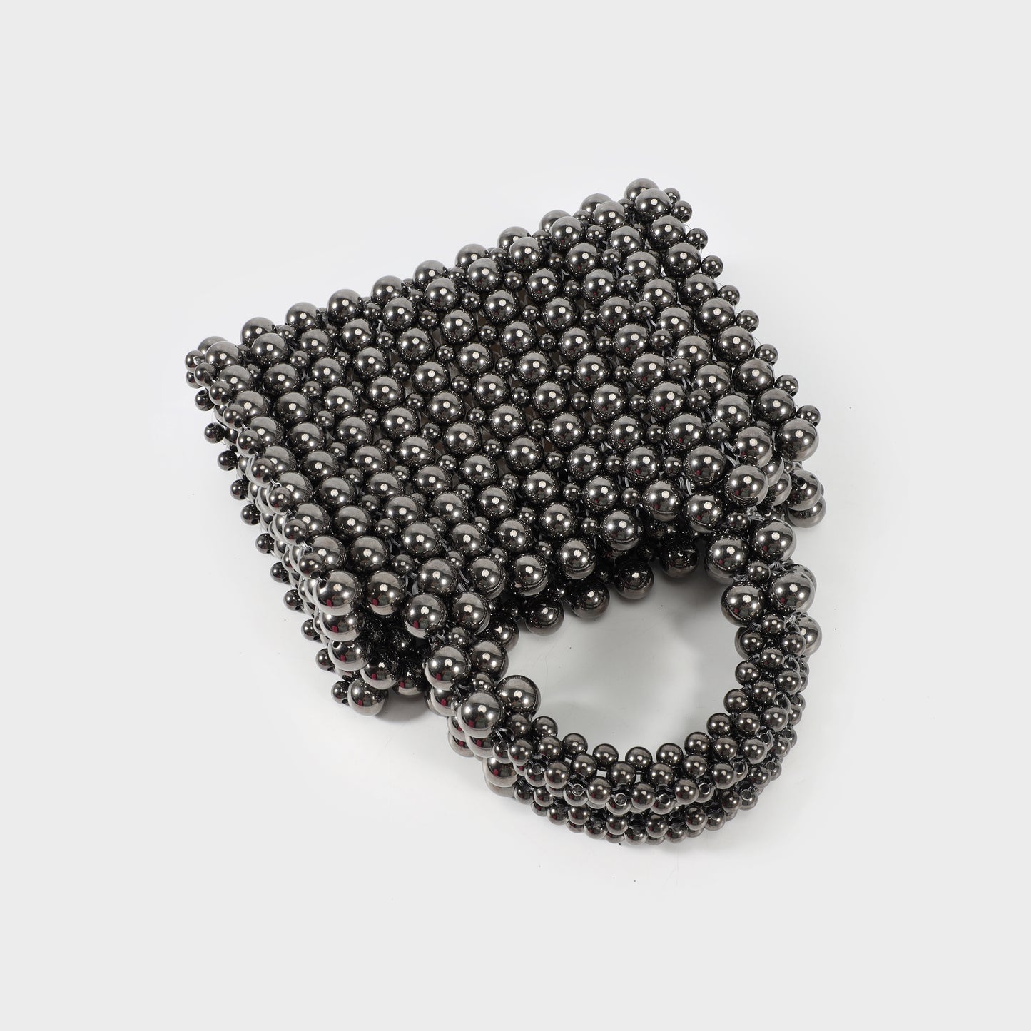Trunk-shaped handbag with beads